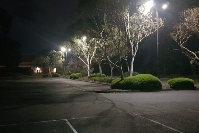 Poorly lit council carpark at night